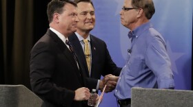 Senate candidates Todd Rokita, , from left, Luke Messer and Mike Braun speak with each other following the Indiana Republican Senate Primary Debate, Monday, April 30, 2018, in Indianapolis.