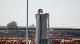 In a farming area east of Tulare, Calif., fields of corn and dairy herds depend on water from wells like this one. The state is now limiting the use of this groundwater.