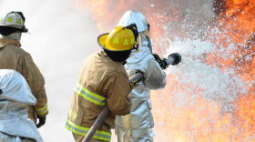 Firefighters blast a stream of aqueous film-forming firefighting foam that was used for decades to extinguish fires involving a flammable liquid like aviation fuel. That's why PFAS contamination often can be found around airfields, like Eielson's.