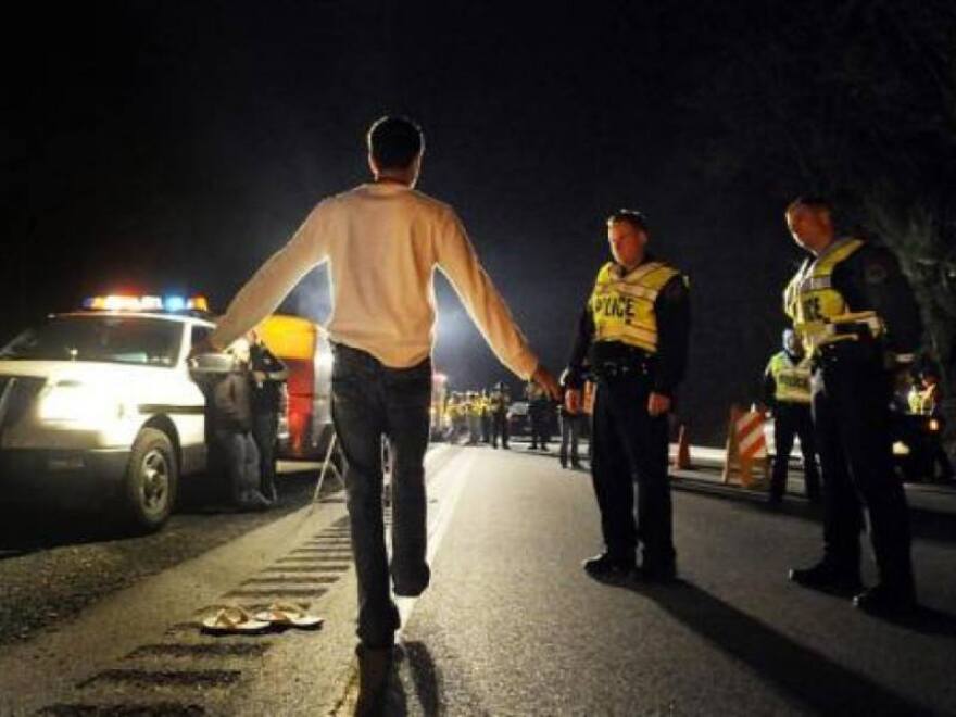 Law enforcement officers conduct a traffic stop in Colorado. 