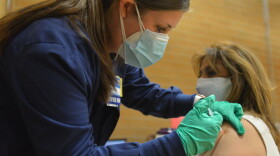 Certified registered nurse Raechel Blades gives Patricia Benavides, 55, her second dose of the Moderna vaccine on Monday, March 8 2021 at the Tony Aguirre Community Center.2