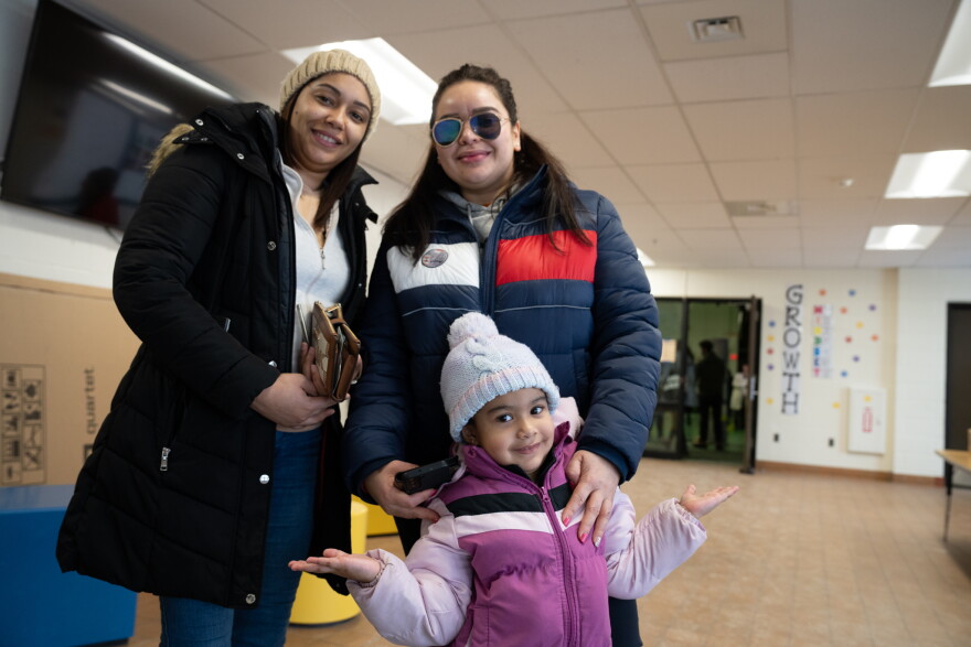 Elin Peña (L) and Loli Fernandez (R), with Fernandez's daughter, Soleli.