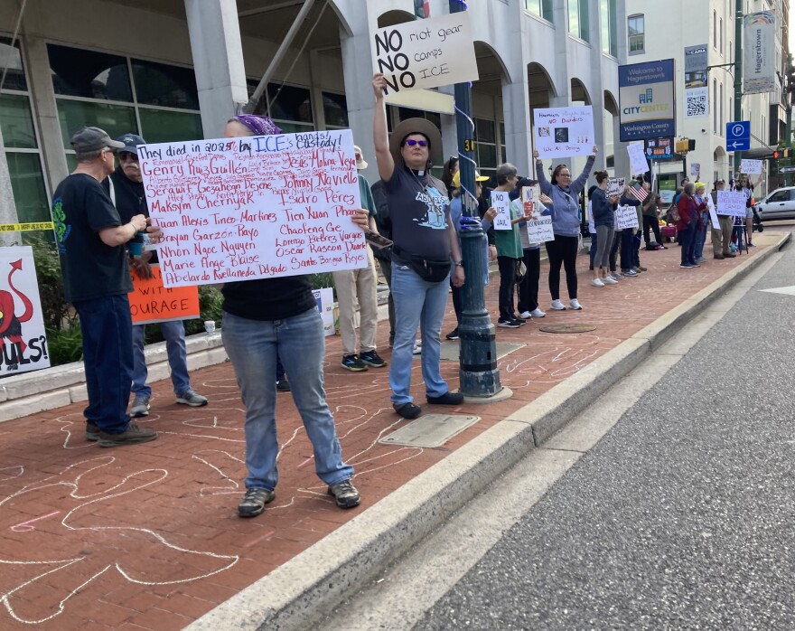 Protestors line the sidewalk outside the Washington County Commissioners building, opposed to the purchase of more than $100,000 in riot gear