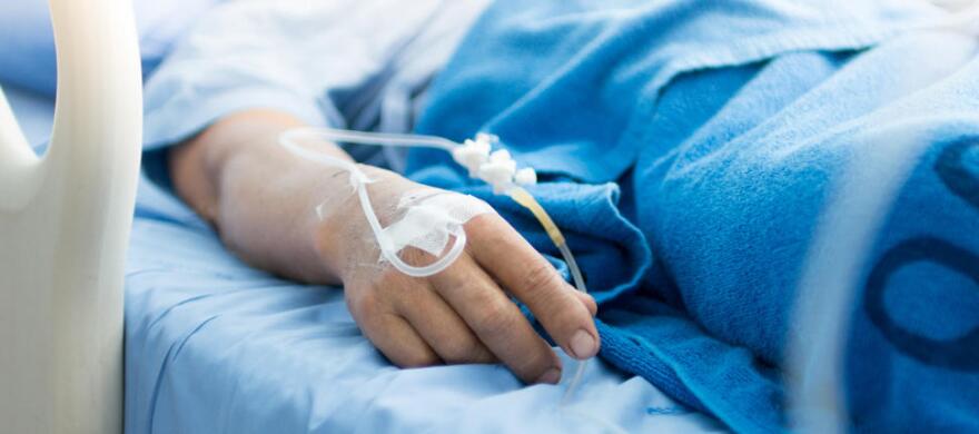 arm of a person laying in a hospital bed