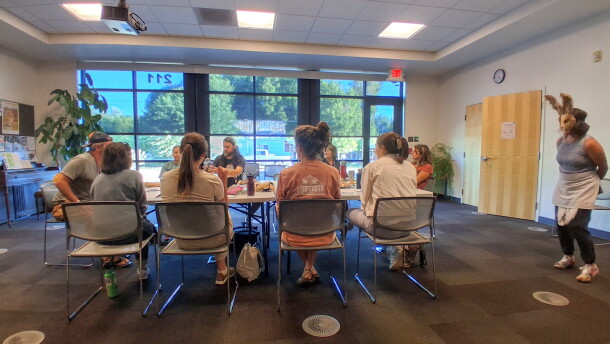 A group of actors rehearses an argumentative dinner scene at the Mancos Public Library ahead of the Golden Fox Paradox.