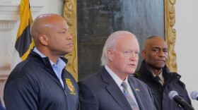 Maryland Secretary of Emergency Management Russell Strickland (center) and Gov. Wes Moore (left) announce a state of emergency in Maryland on Friday in the Governor's Reception Room in Annapolis, Md.