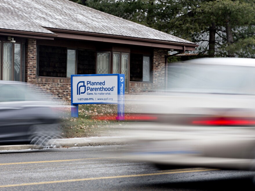 Vehicles drive past a Planned Parenthood office in Peoria, Ill., in December 2016.