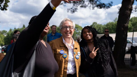 Oregon Gov. Tina Kotek poses for a selfie at the Oaks Amusement Park in Portland, Ore., where several unions held a Labor Day picnic on Sept. 7, 2026. Kotek spent part of Monday campaigning at the picnic and mingling with other election candidates ahead of the November primary.