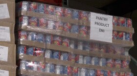 Cans of tomatoes are stacked in the warehouse at the Hoosier Hills Food Bank.