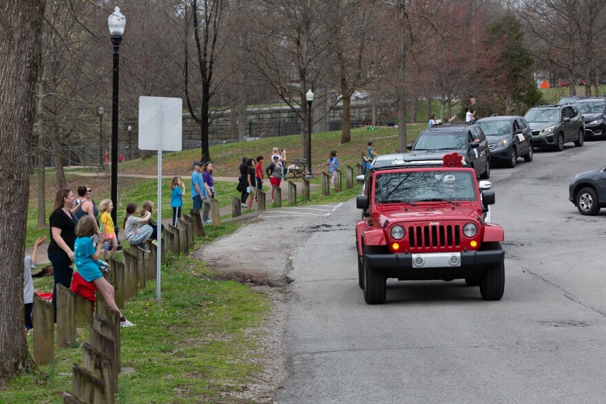 Students, parents, and teachers exchange enthusiastic waves and greetings from a distance during today's Bloom Elementary Staff Parade. School staff organized the parade is an effort to remind students that their teachers are thinking of them while schools remain closed.