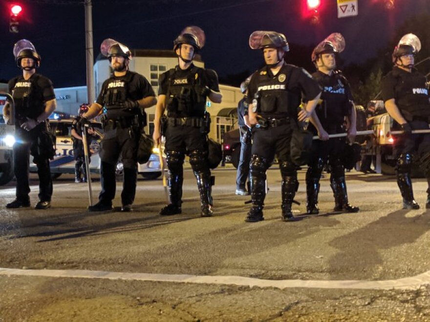 Cops block the street in front of Starbucks in the Highlands late Saturday.