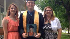 From left: Katharine Melvin, Spencer Melvin (holding a photograph of Erin, who died while her mother was pregnant with him), and their sister Anne King.