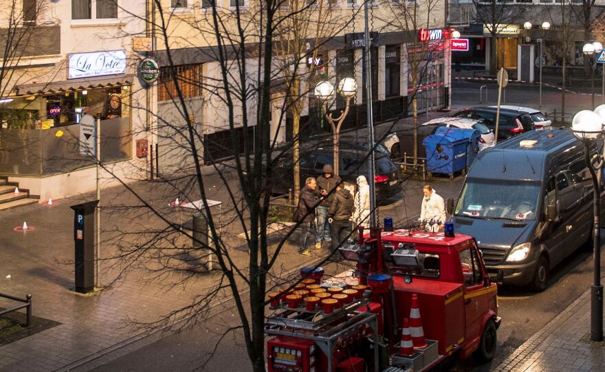 Forensic police work at a crime scene in front of a bar and hookah lounge at the Heumarkt in downtown Hanau, near Frankfurt, on Thursday.