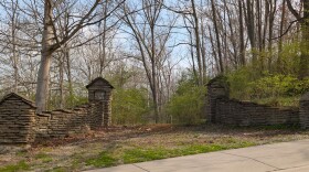 Ornamental pillars flank a driveway