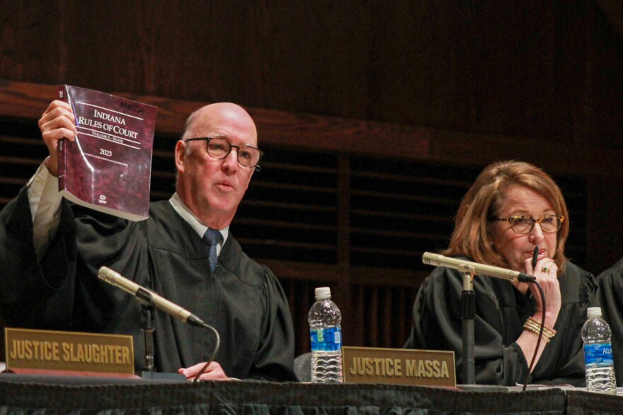 Indiana Supreme Court Justice Mark Massa speaks to students during a Q&A at the University of Indianapolis on Tuesday, April 11, 2023. Chief Justice Loretta Rush sits beside him.