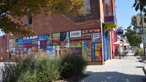 A mural on a brick wall in Uptown Normal