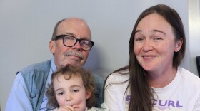 Jim Thomas his granddaughter Rhiannon, and daughter Sarah Thomas in St. George, at their StoryCorps interview in May 2025.