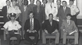 Sgt. Perry White, left, stands among NOPD officers receiving reward checks in 1971. White is pictured in the second row, second from left.