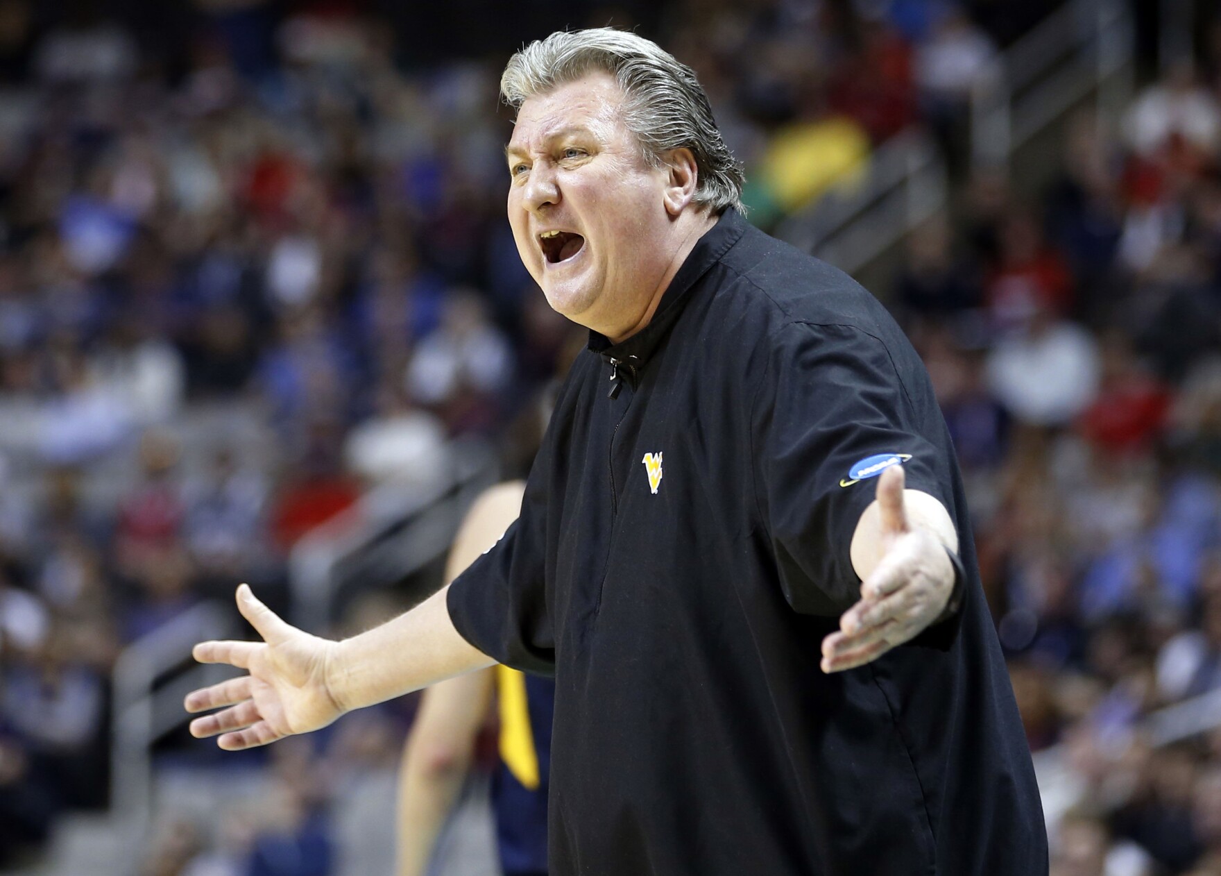 West Virginia head coach Bob Huggins yells from the sideline during the first half of an NCAA Tournament college basketball regional semifinal game against Gonzaga in San Jose, Calif.
