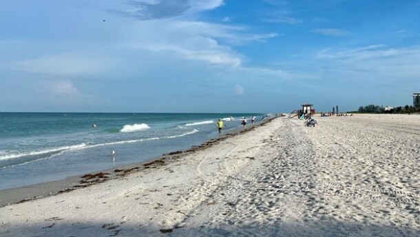 People walking along a beach