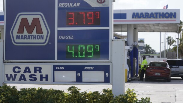 A customer pumps gas at a Marathon gas station, Tuesday, Aug. 22, 2023, in North Miami.