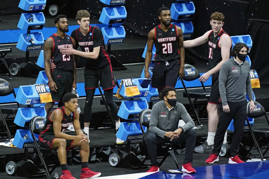 Hartford players watch the final moments of their loss to Baylor during a college basketball game in the first round of the NCAA tournament at Lucas Oil Stadium in Indianapolis Friday, March 19, 2021, in Indianapolis, Tenn. 