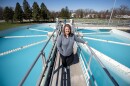 Christina Murphy, general manager of West Des Moines Water Works, stands on a walkway over water tanks at the facility Tuesday, April 8, 2025, in West Des Moines, Iowa.
