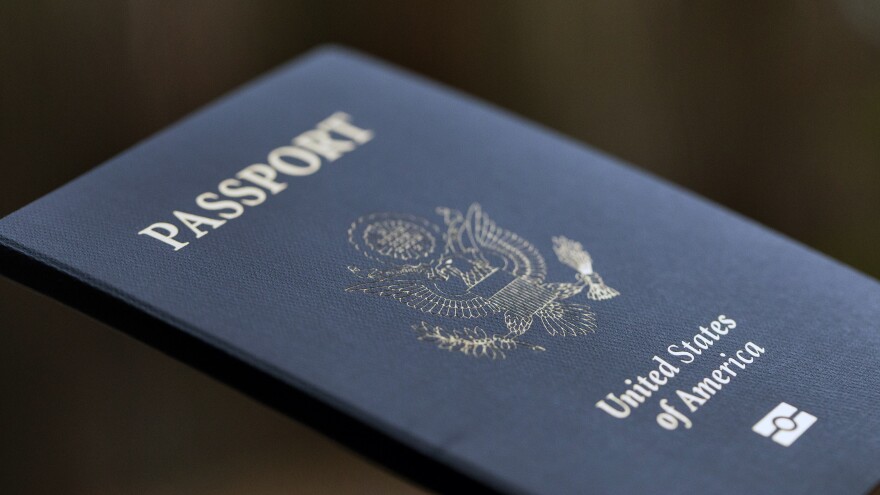 A new executive order from President Biden calls on the State Department to create a system where passports can be renewed online. [Jenny Kane / AP]