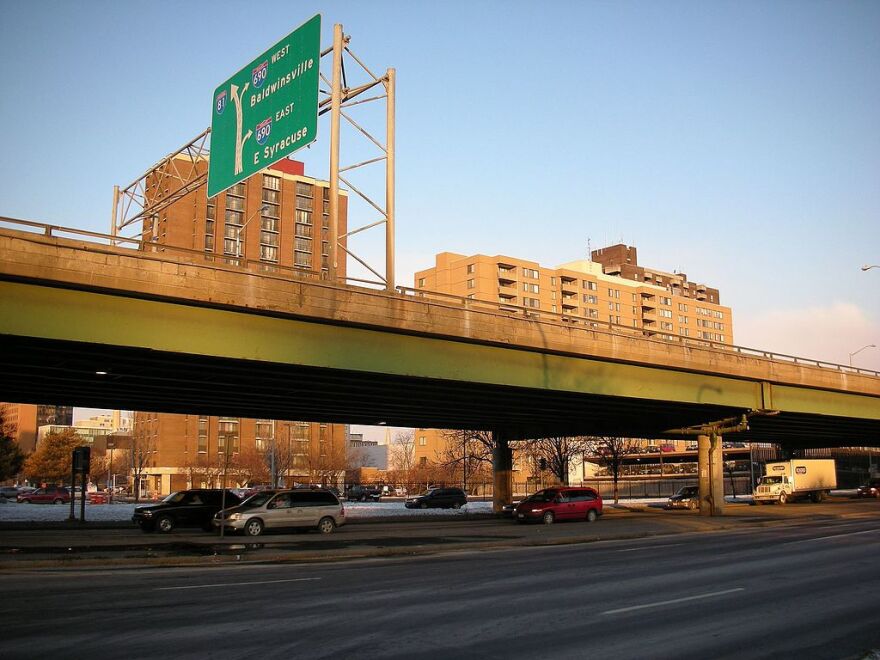  Cars drive underneath the I-81 viaduct in downtown Syracuse. 