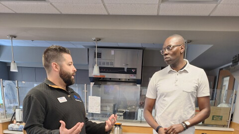 Lt. Gov. Garlin Gilchrist (r) speaks to Jacobetti Home for Veterans Administrator Chris LaJoie.