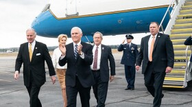 Peggy McMaster walks behind her husband, Gov. Henry McMaster (on far left), as he greets Vice President Mike Pence earlier this year.