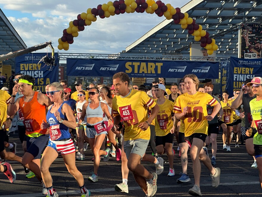 Runners take off at the start line of Pat's Run, a 4.2-mile race honoring former NFL player and Army Ranger Pat Tillman, in Tempe, Ariz., on Saturday, April 11, 2026. (AP Photo/John Marshall)