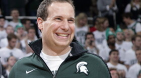 FILE -Former Michigan State player Mat Ishbia laughs as he are introduced along with Michigan State's 2000 national championship NCAA college basketball team during halftime of the Michigan State-Florida game in East Lansing, Mich. Mortgage executive Mat Ishbia has agreed in principle to buy the Phoenix Suns and Phoenix Mercury from the embattled owner Robert Sarver for $4 billion, a person with knowledge of the negotiations told The Associated Press on Tuesday, Dec. 20, 2022. (AP Photo/Al Goldis, File)