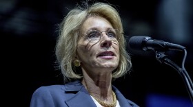 President-elect Donald Trump's pick for Education Secretary Betsy DeVos speaks during a rally at DeltaPlex Arena, Friday, Dec. 9, 2016, in Grand Rapids, Mich.