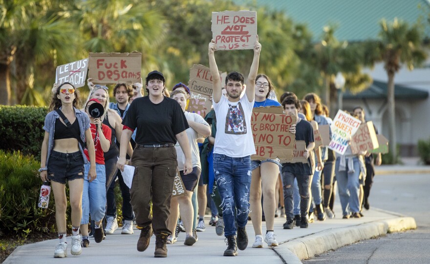 FGCU students protest at a campaign rally for Florida Governor Ron DeSantis on Sunday at Alico Arena in Fort Myers. The students marched from the campus' Veterans Pavilion to Alico Arena in protest of DeSantis speaking at the rally. The protest was organized by the Young Democratic Socialists of America at FGCU, who oppose DeSantis' policies on education, LGBTQ and abortion.