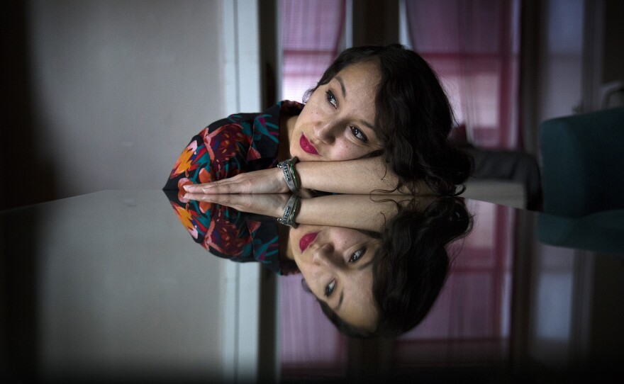 Photographer Marilyn Montufar poses for a portrait on Wednesday, Feb. 14, 2018, in Seattle.