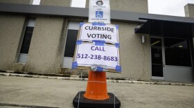 Curbside voter being helped at PRISD Hartfield Performing Arts voting center on the last day of early voting on Nov. 4, 2022. Curbside voting is available for people with disability. Patricia Lim/KUT