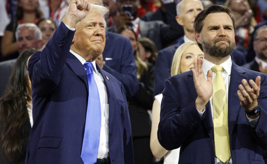 Former President Donald Trump, left, and his runningmate JD Vance, right, stare toward the stage during the session at the Fiserv Forum for the Republican National Convention in Milwaukee, Wis., Tuesday, July 17, 2024. (Ashleigh Lucas/WUFT News)