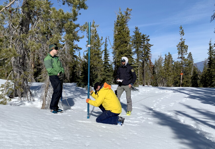  Lutz, Beverly and Lazzeri recording snow measurements. 