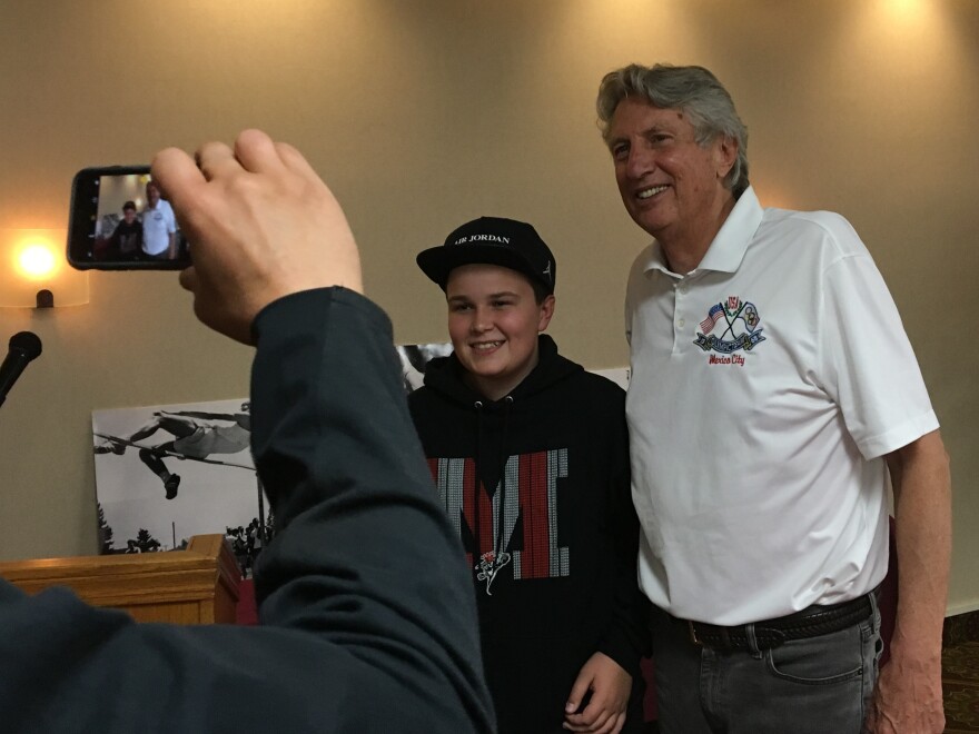 Former Olympic high jump champion Dick Fosbury poses with Cooper Cox of Medford, Ore. during a book signing appearance. Fosbury, who grew up in Medford, won the high jump gold medal at the 1968 Mexico City Olympics and set an Olympic and U.S. record at the time.