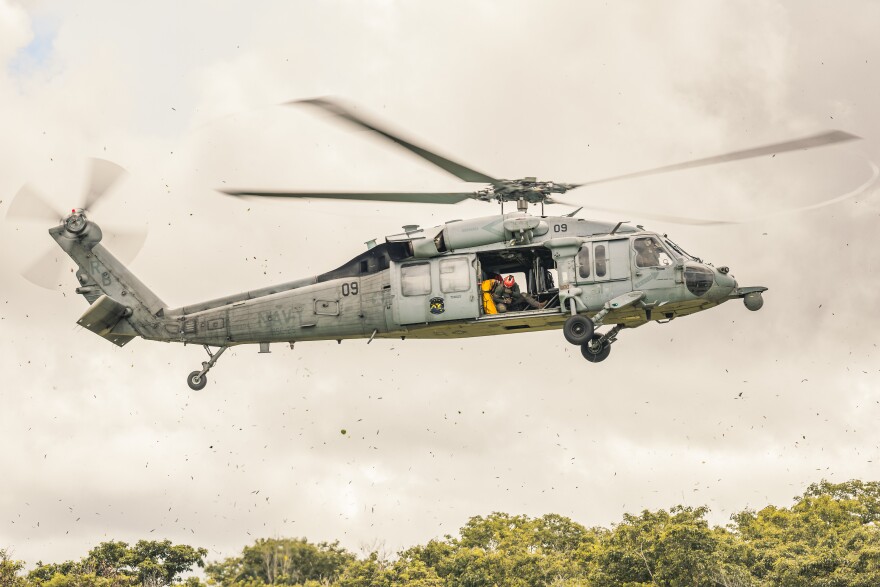 An MH-60S Seahawk assigned to Helicopter Sea Combat Squadron 25 prepares to land at Joint Region Marianas headquarters to transport senior leaders for an aerial tour of critical infrastructure sites across Guam on July 23, 2025.