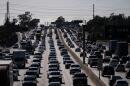 Traffic moves along the 91 Freeway, in Cerritos, Calif., on April 1, 2026. (Jae C. Hong/AP)