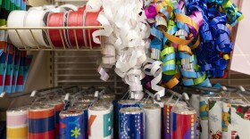 Ribbons and wrapping paper on display in a store.