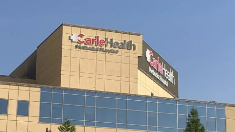 A medical building that says "Carle Health Methodist Hospital"