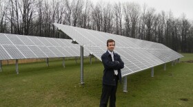 Standing next to a 25 Kw solar array, Daniel Montante says the installation will power up to 75 percent of the energy needs of a building at Riverview Solar Technology Park.