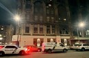 Scranton police vehicles line Biden Street outside the Hotel Jermyn Tuesday evening, Dec. 9, 2025, following a stabbing inside the downtown apartment building that left two women dead and another critically injured.