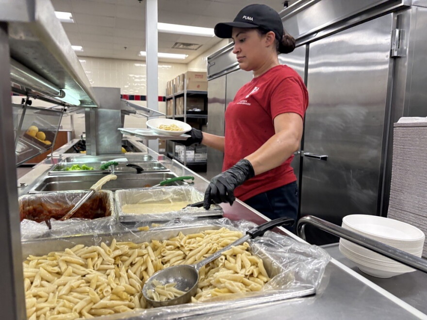 A cafeteria worker serves lunch at District U-46 in South Elgin, Illinois.