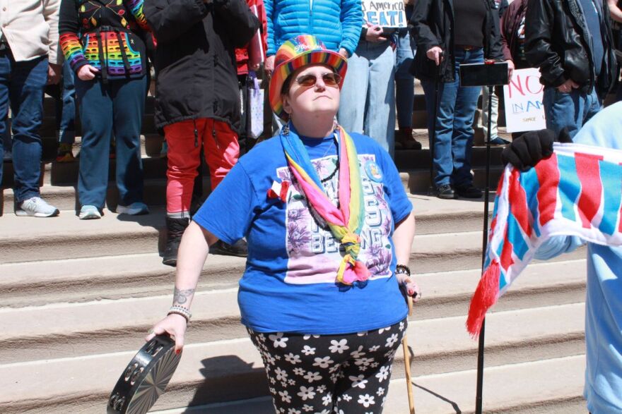 Organizer Julia Vaughn stands on the steps of the Indiana Statehouse during the March 28, 2026 protest.