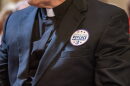 Stickers saying “repeal and replace Amendment 3” are distributed during Missouri Right to Life advocacy day at the Missouri State Capitol on March 26, 2025.