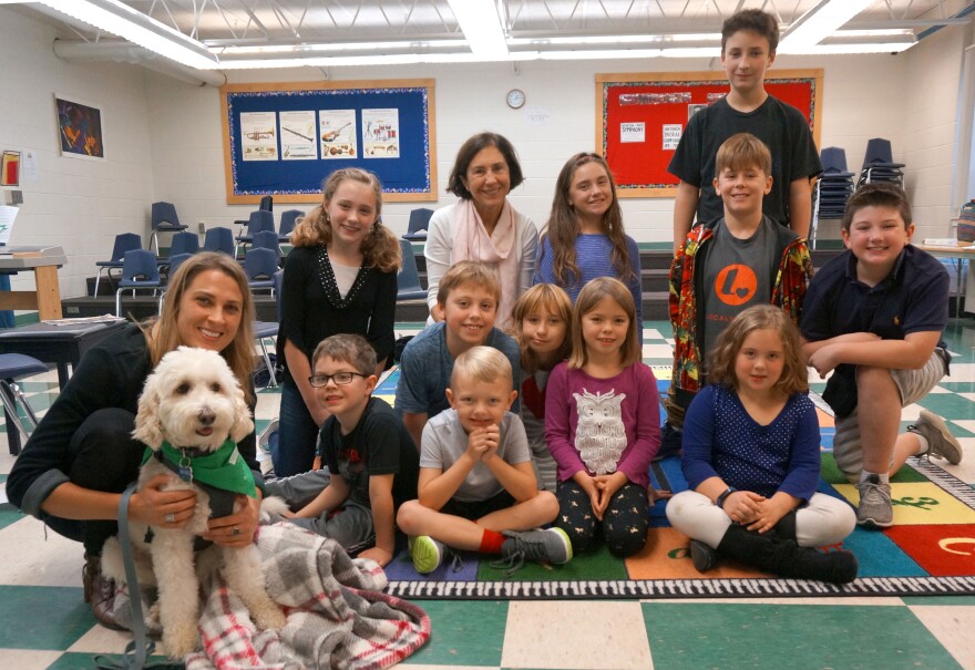 First and fifth grade reading buddies at Chamberlin School spent time with Sarah Genest and her therapy dog Hobie. The first graders read to Hobie during their visit. The fifth graders read about a dog like Hobie in 'When Friendship Followed Me Home.'